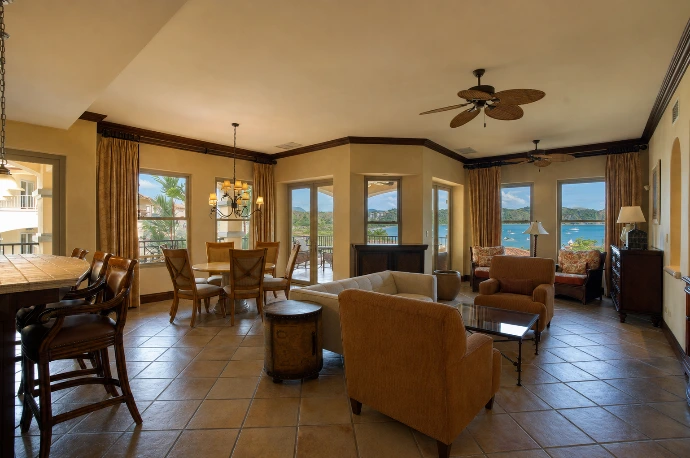 Open-plan living and dining area at Marbella 6D, featuring elevated second-floor views over Herradura Bay and the Pacific Ocean at Los Sueños Resort in Costa Rica.