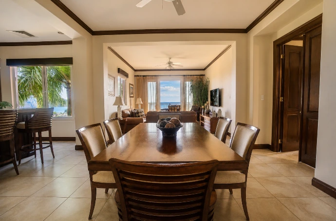 Elegant living room at Altavista 1A with warm natural light, refined tropical interiors, and panoramic Pacific Ocean views at Los Sueños Resort, Costa Rica.