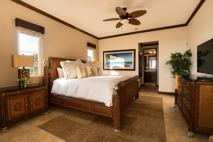 Primary bedroom at Altavista 1A featuring a king-size bed, warm natural light, rich wood furnishings, and refined tropical interiors at Los Sueños Resort, Costa Rica.