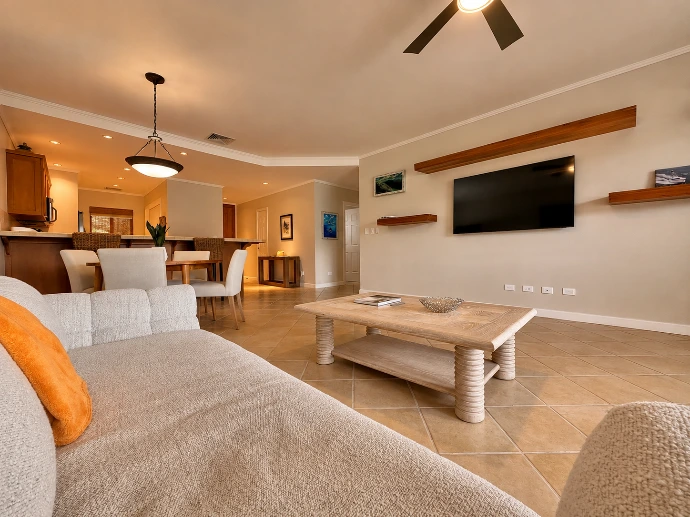 Living room with a dining area and open kitchen at Del Mar 4D in Los Sueños Resort.